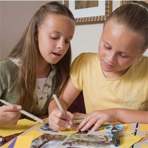 Two young girls drawing